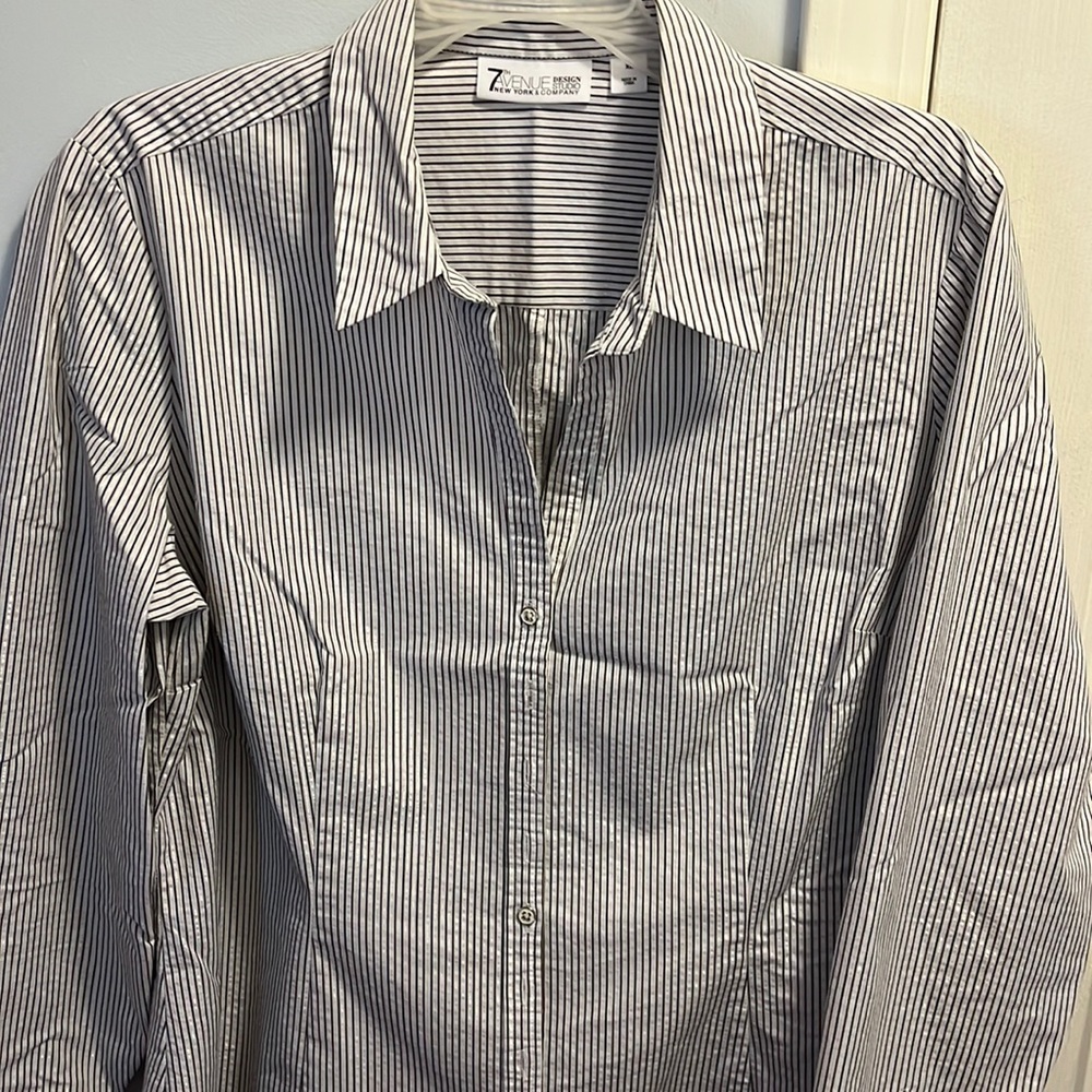 Woman long sleeve black and white striped shirt.